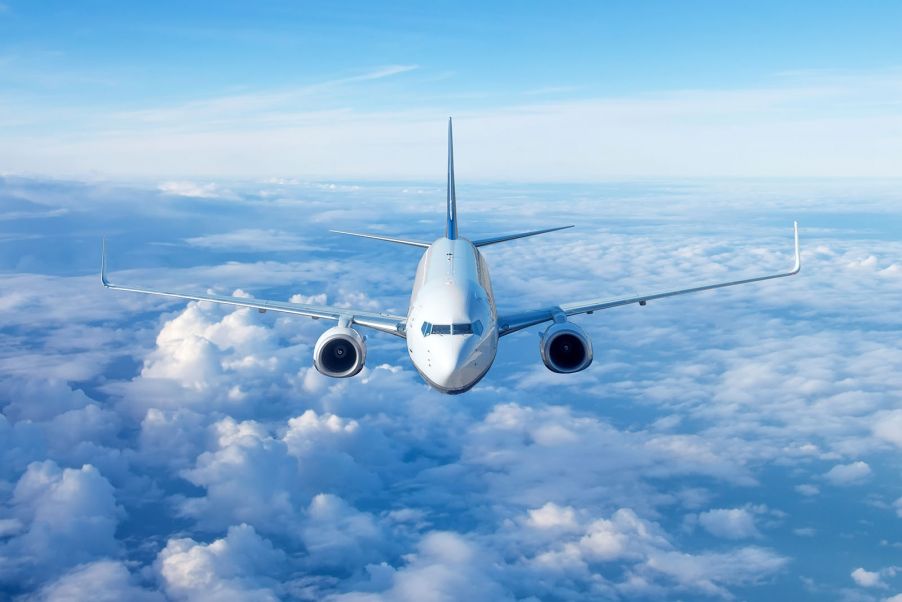 Airplane flying above the clouds