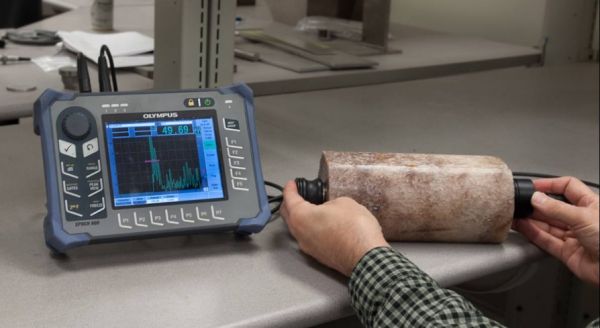 Ultrasonic velocity and attenuation measurements in geological samples